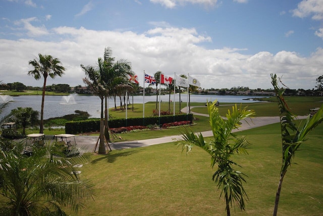 view of community featuring a yard and a water view