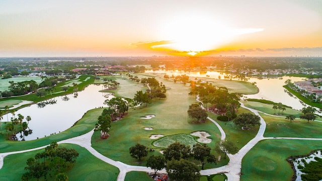 aerial view at dusk with a water view