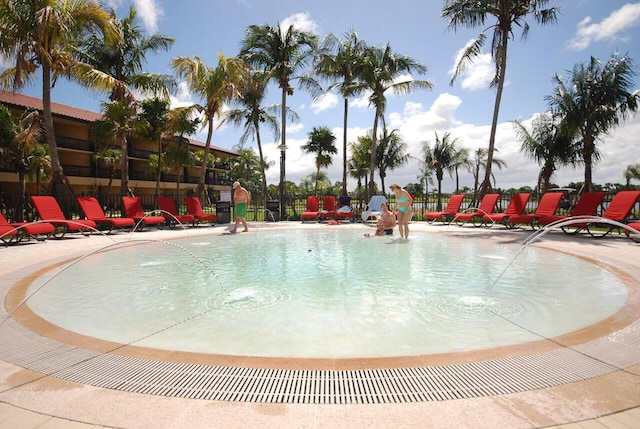 view of swimming pool featuring pool water feature