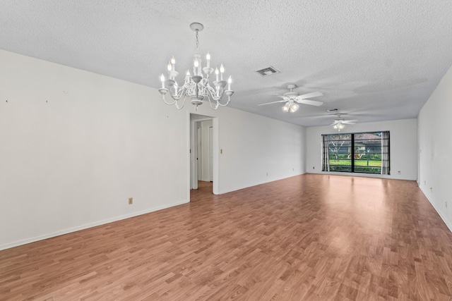 10439 Quailwood Ln Unit B, Boynton Beach, FL 33436 - unfurnished room with a chandelier, a textured ceiling, light wood-type flooring, and ceiling fan