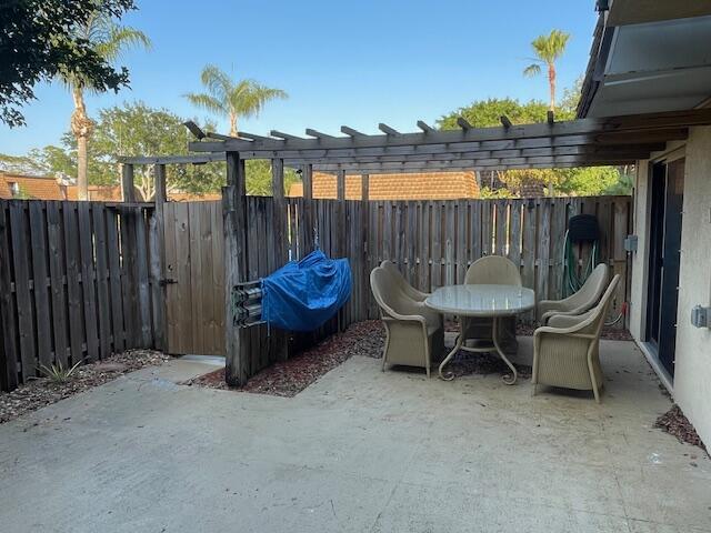 view of patio featuring a pergola and a fenced backyard