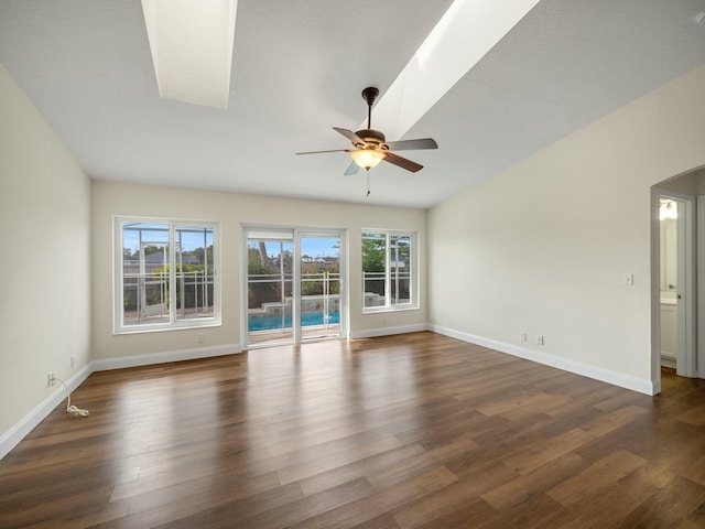 spare room with dark wood-type flooring and ceiling fan