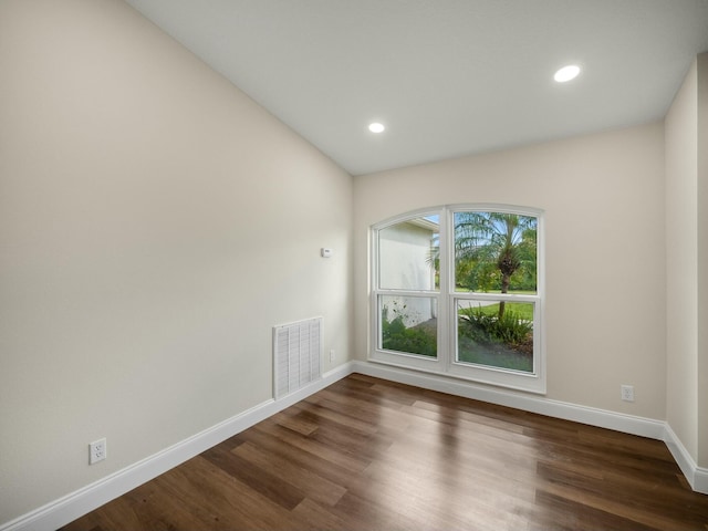 unfurnished room featuring dark hardwood / wood-style flooring