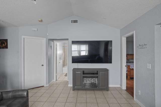 unfurnished living room featuring lofted ceiling, visible vents, a textured ceiling, and light tile patterned floors