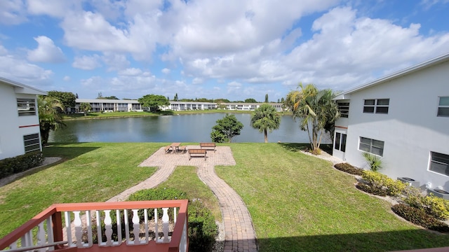 view of yard featuring a water view and a patio area