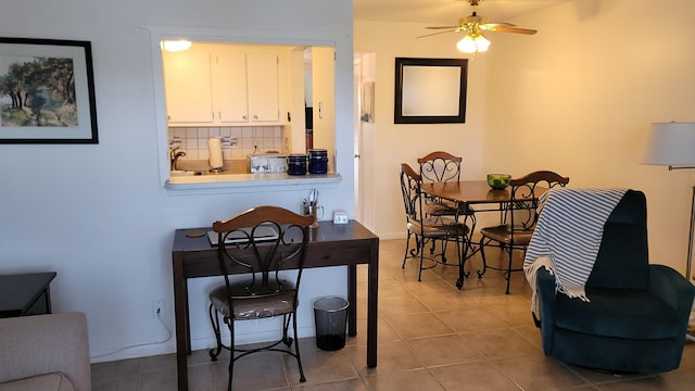 dining area with ceiling fan and light tile patterned floors