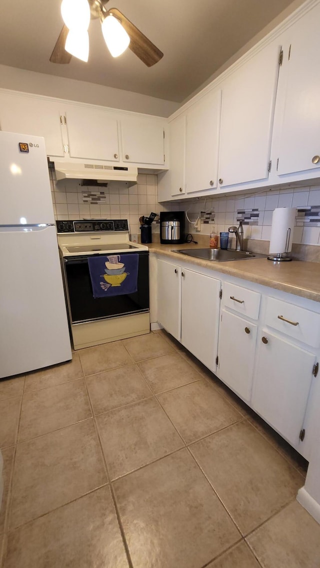 kitchen featuring tasteful backsplash, sink, white appliances, and white cabinets