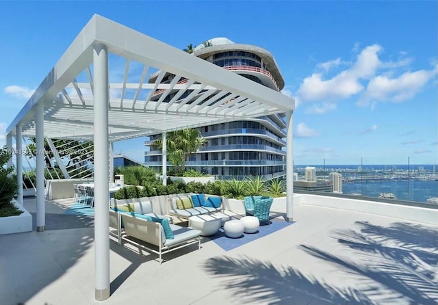 view of patio with a water view and an outdoor hangout area