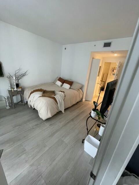 bedroom with light hardwood / wood-style flooring