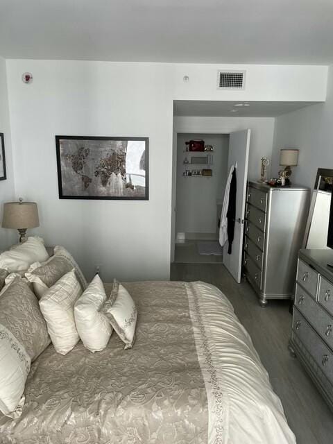 bedroom featuring dark wood-type flooring