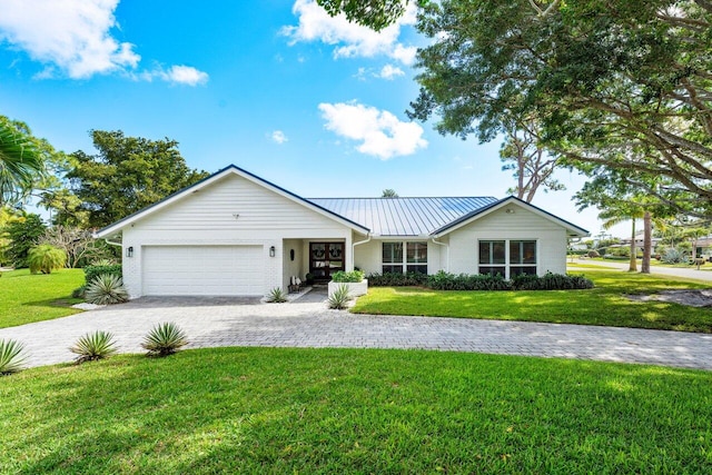 single story home with a garage and a front yard