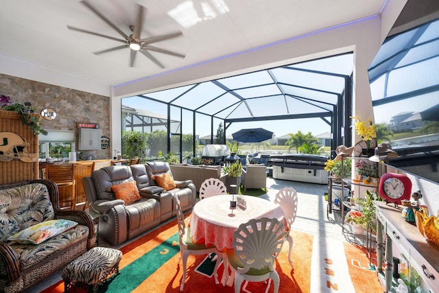 sunroom featuring a ceiling fan, outdoor lounge area, a hot tub, and outdoor dining area