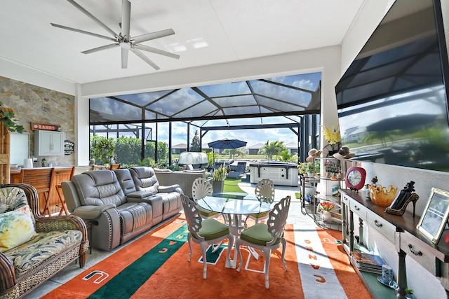 sunroom / solarium featuring a ceiling fan, an outdoor living space, and outdoor dining space
