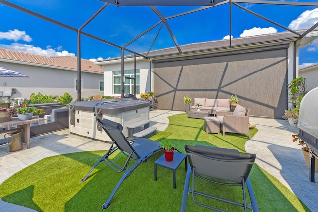 view of patio / terrace with outdoor lounge area, a hot tub, and glass enclosure