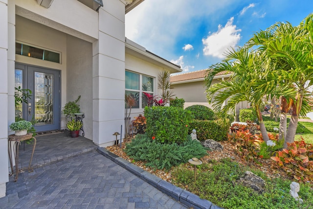 doorway to property with stucco siding