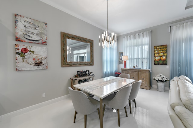 dining area with a chandelier, baseboards, and ornamental molding