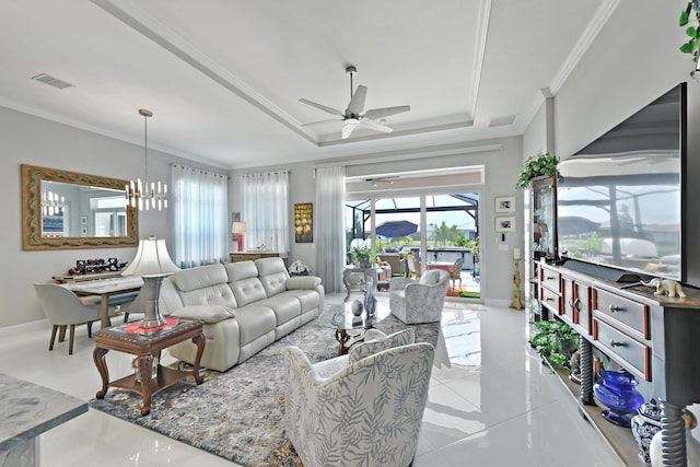 living room with ornamental molding, a raised ceiling, ceiling fan, baseboards, and light tile patterned flooring