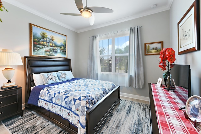 bedroom featuring wood finished floors, baseboards, ornamental molding, and a ceiling fan