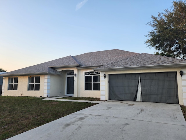 view of front of property with a garage, a shingled roof, concrete driveway, and stucco siding