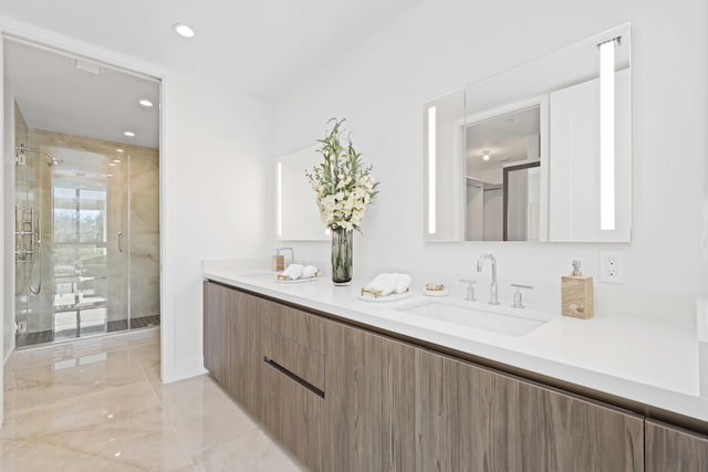 bathroom featuring vanity and a shower with shower door