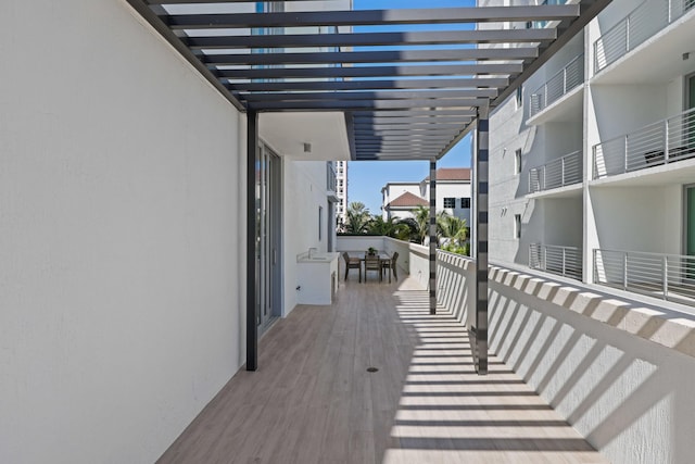 wooden deck featuring a pergola