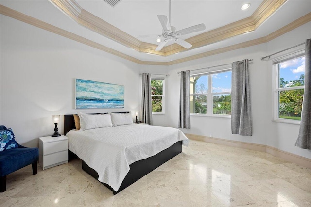 bedroom featuring crown molding, a raised ceiling, and ceiling fan