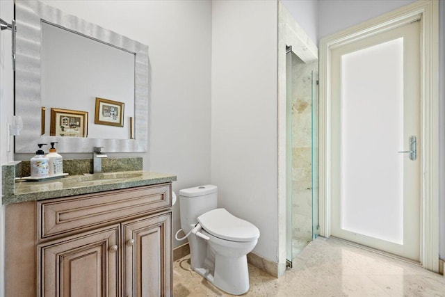 bathroom featuring walk in shower, vanity, and toilet