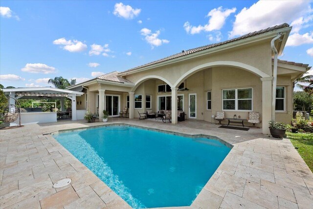 rear view of property with a patio