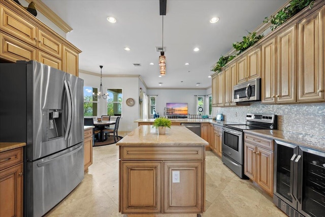 kitchen featuring a kitchen island, appliances with stainless steel finishes, pendant lighting, wine cooler, and kitchen peninsula