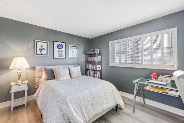 bedroom featuring light wood-type flooring