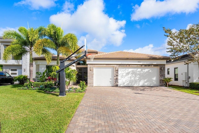 view of front facade with a garage and a front yard