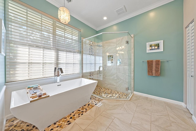 bathroom featuring crown molding, shower with separate bathtub, and a chandelier