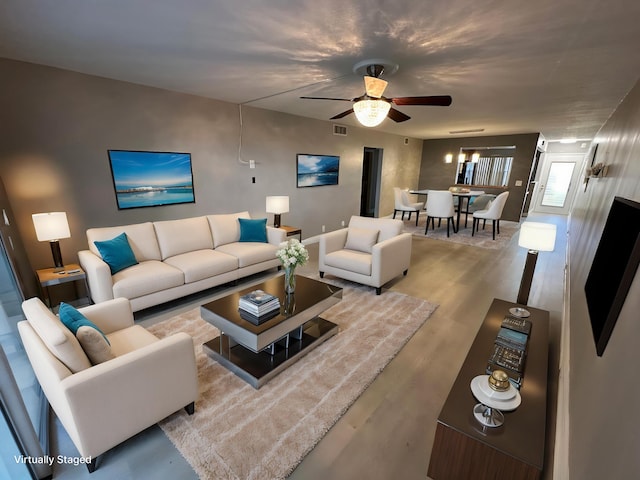 2201 Lucaya Bnd Unit M1, Coconut Creek, FL 33066 - living area with a ceiling fan, wood finished floors, and visible vents