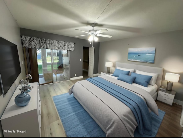 2201 Lucaya Bnd Unit M1, Coconut Creek, FL 33066 - bedroom featuring baseboards, ceiling fan, and wood finished floors