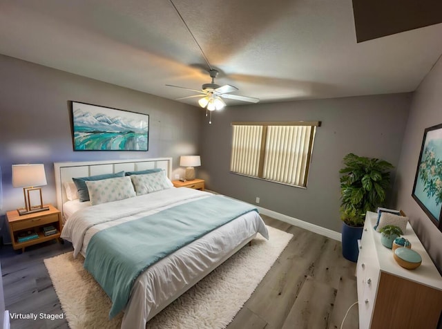 2201 Lucaya Bnd Unit M1, Coconut Creek, FL 33066 - bedroom with baseboards, a ceiling fan, and wood finished floors