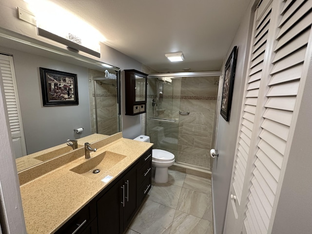 2201 Lucaya Bnd Unit M1, Coconut Creek, FL 33066 - bathroom with a shower stall, vanity, a closet, toilet, and marble finish floor