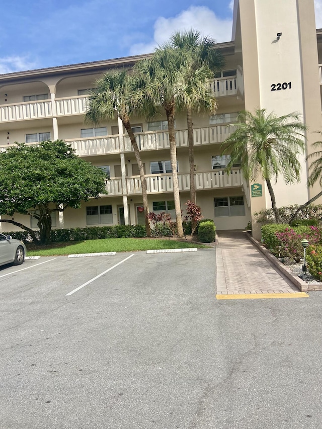 2201 Lucaya Bnd Unit M1, Coconut Creek, FL 33066 - view of property featuring uncovered parking