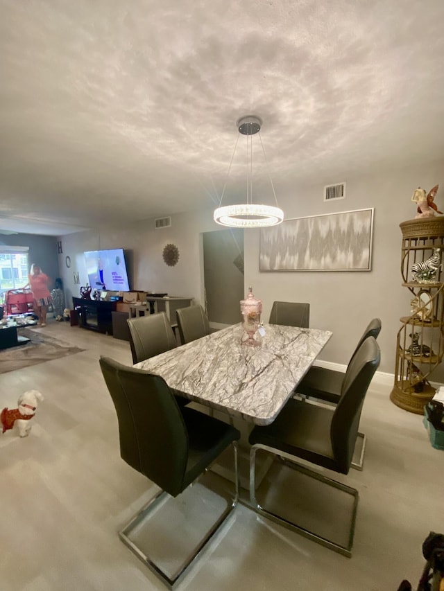 view of carpeted dining area