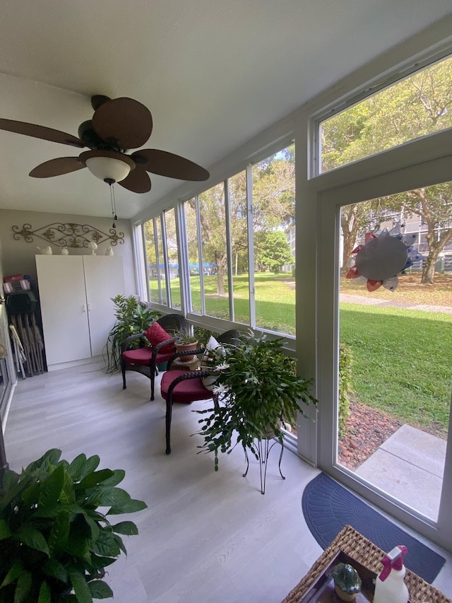 sunroom / solarium with ceiling fan and a wealth of natural light