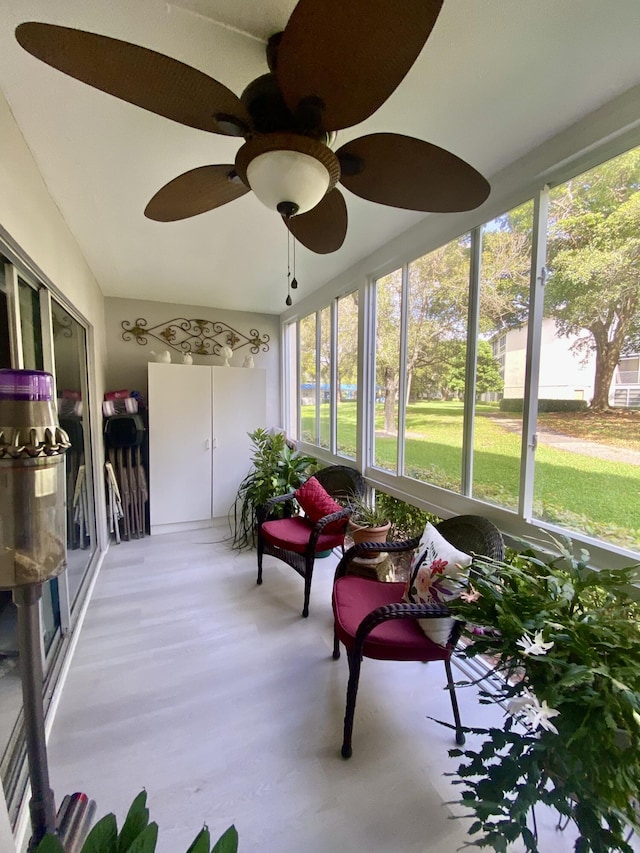 sunroom / solarium with ceiling fan