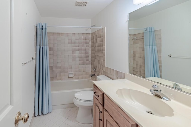 full bathroom with shower / tub combo with curtain, tile patterned floors, toilet, and vanity