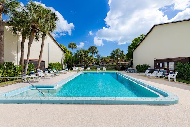 view of swimming pool with a patio area