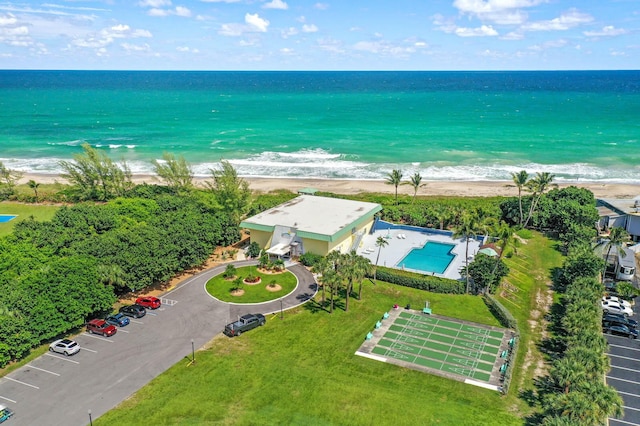 aerial view with a water view and a view of the beach