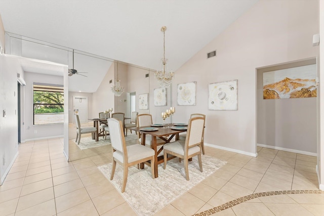 dining space with baseboards, high vaulted ceiling, visible vents, and light tile patterned floors