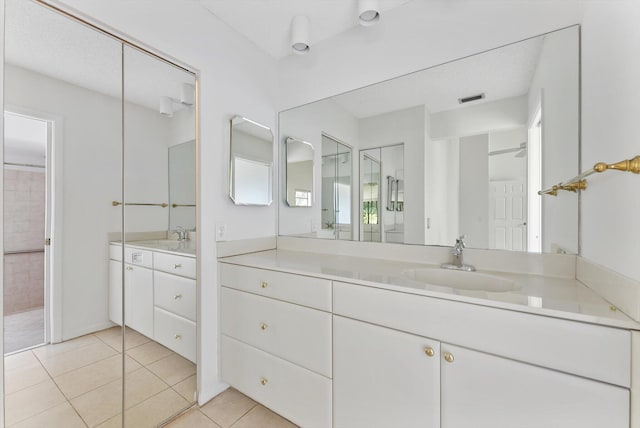 full bath featuring visible vents, tile patterned flooring, and vanity