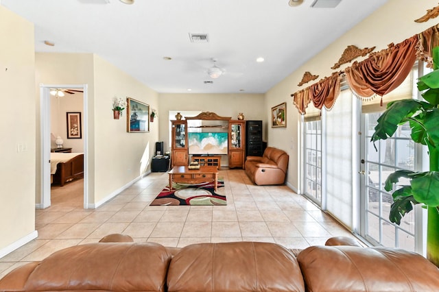 bedroom with light tile patterned flooring, visible vents, access to outside, and baseboards