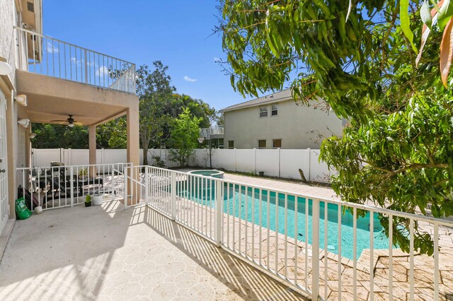 7404 Water Dance Way, Lake Worth, FL 33467 - view of swimming pool with a fenced backyard, ceiling fan, a fenced in pool, a patio, and cooling unit