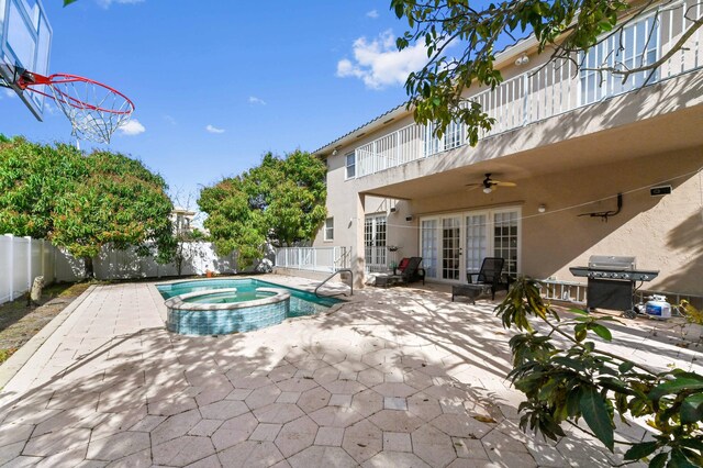 7404 Water Dance Way, Lake Worth, FL 33467 - view of pool with a pool with connected hot tub, a ceiling fan, a fenced backyard, and a patio area