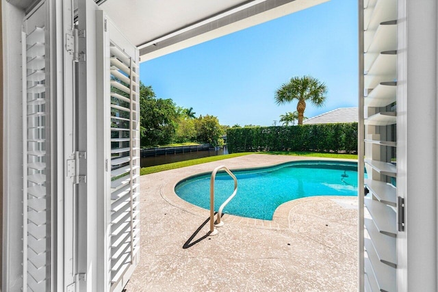 view of pool featuring a fenced in pool and a patio