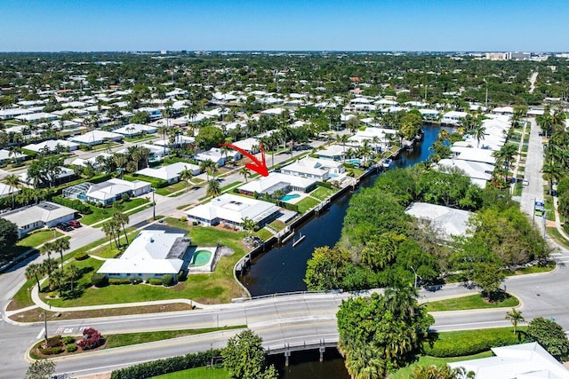 birds eye view of property featuring a residential view and a water view